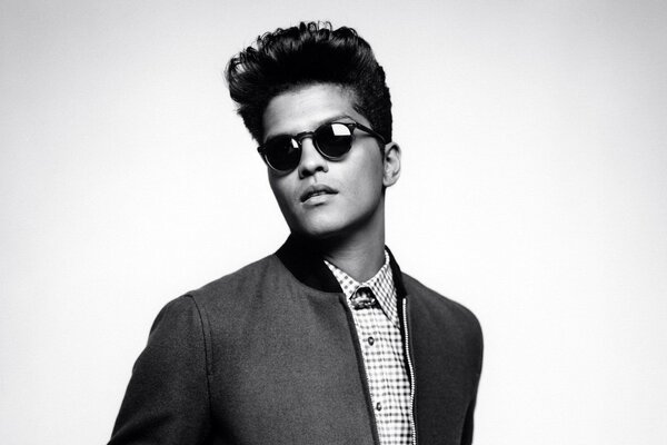 Bruno Mars in black glasses