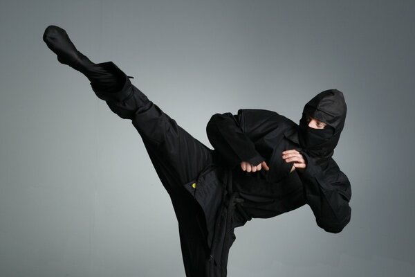 Ninja. Combat exercise. Swing your foot