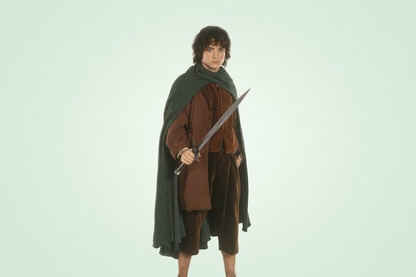 Elijah Wood as Hobbit Frodo Baggins on a white background