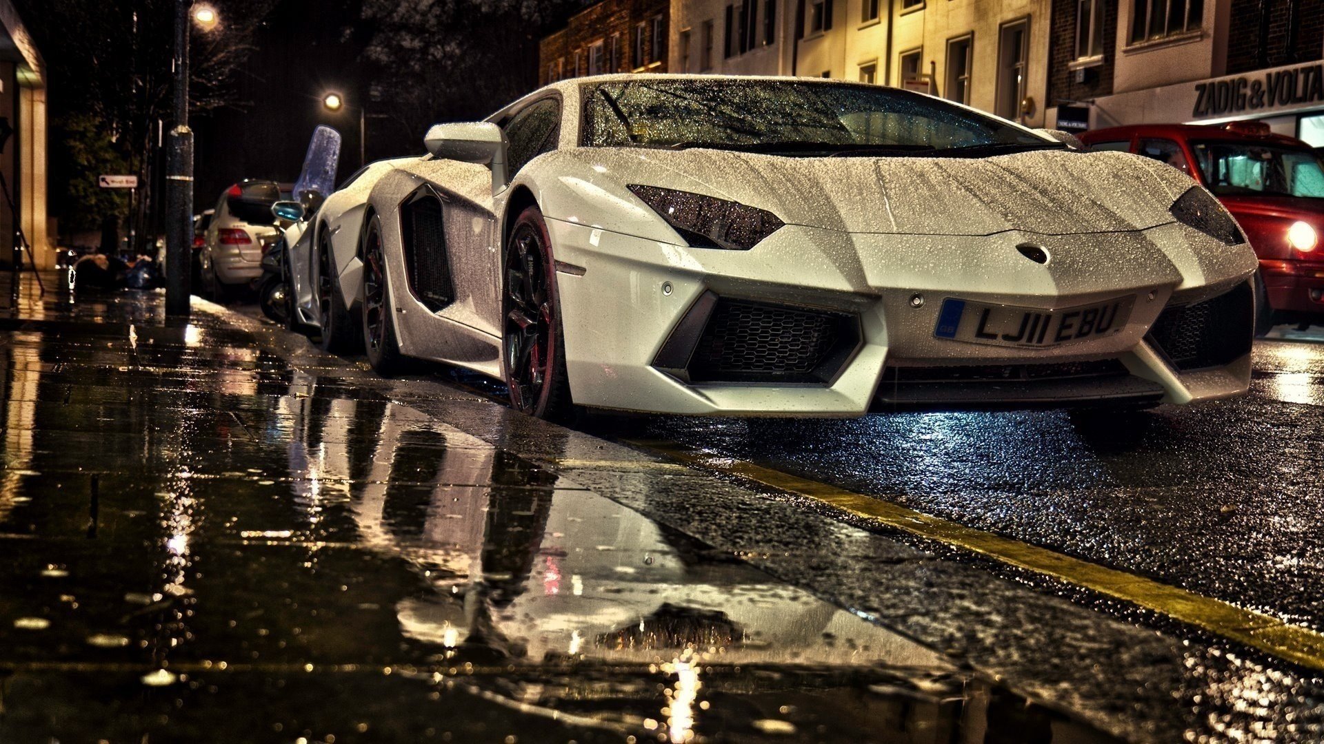 rainy day sports cars night city