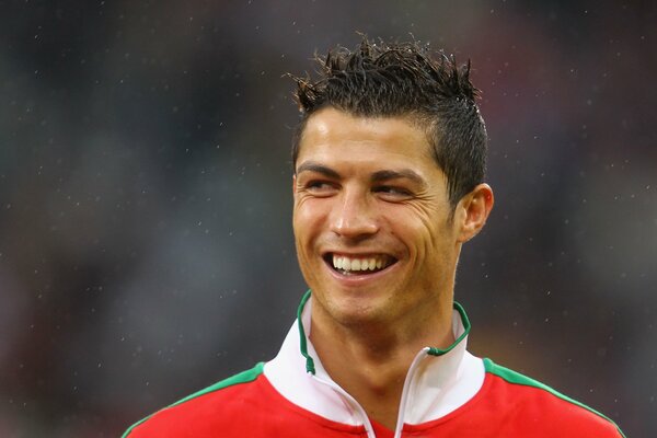 Cristiano Ronaldo smiles in the rain