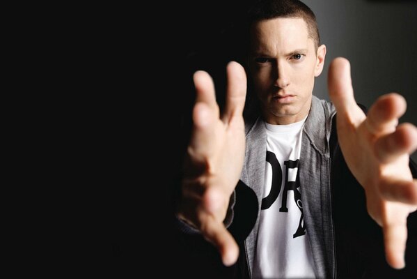 Photo of singer Eminem with outstretched arms