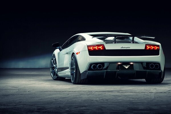 White sports car on a black background