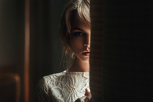 Blonde with cool lips in a white dress