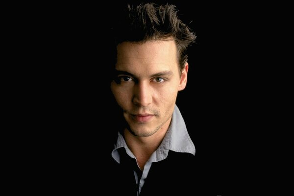 Actor John Depp on a black background