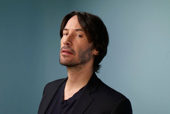 Keanu Reeves on a blue background