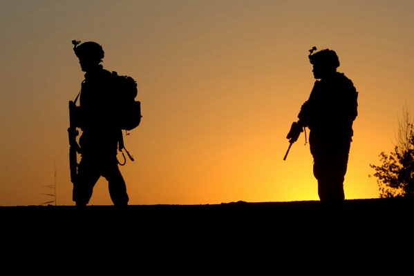 The American army on the background of sunset