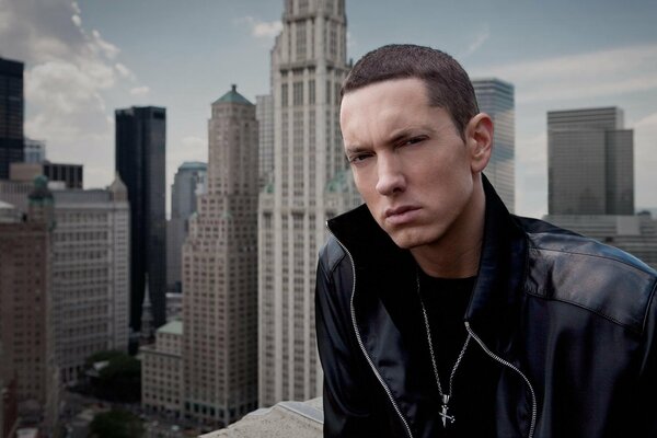 Rap singer Eminem on the background of skyscrapers