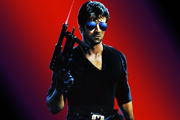Sylvester Stallone with a firearm in fashionable glasses