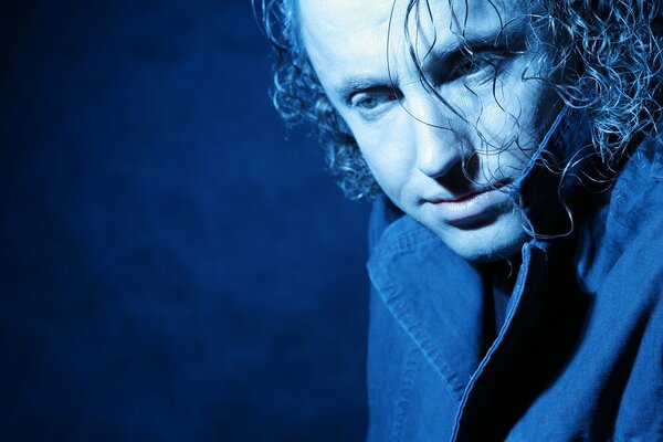 Musician and poet Pavel Kashin in blue light
