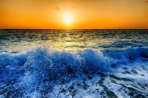 Sunset over the sea wave