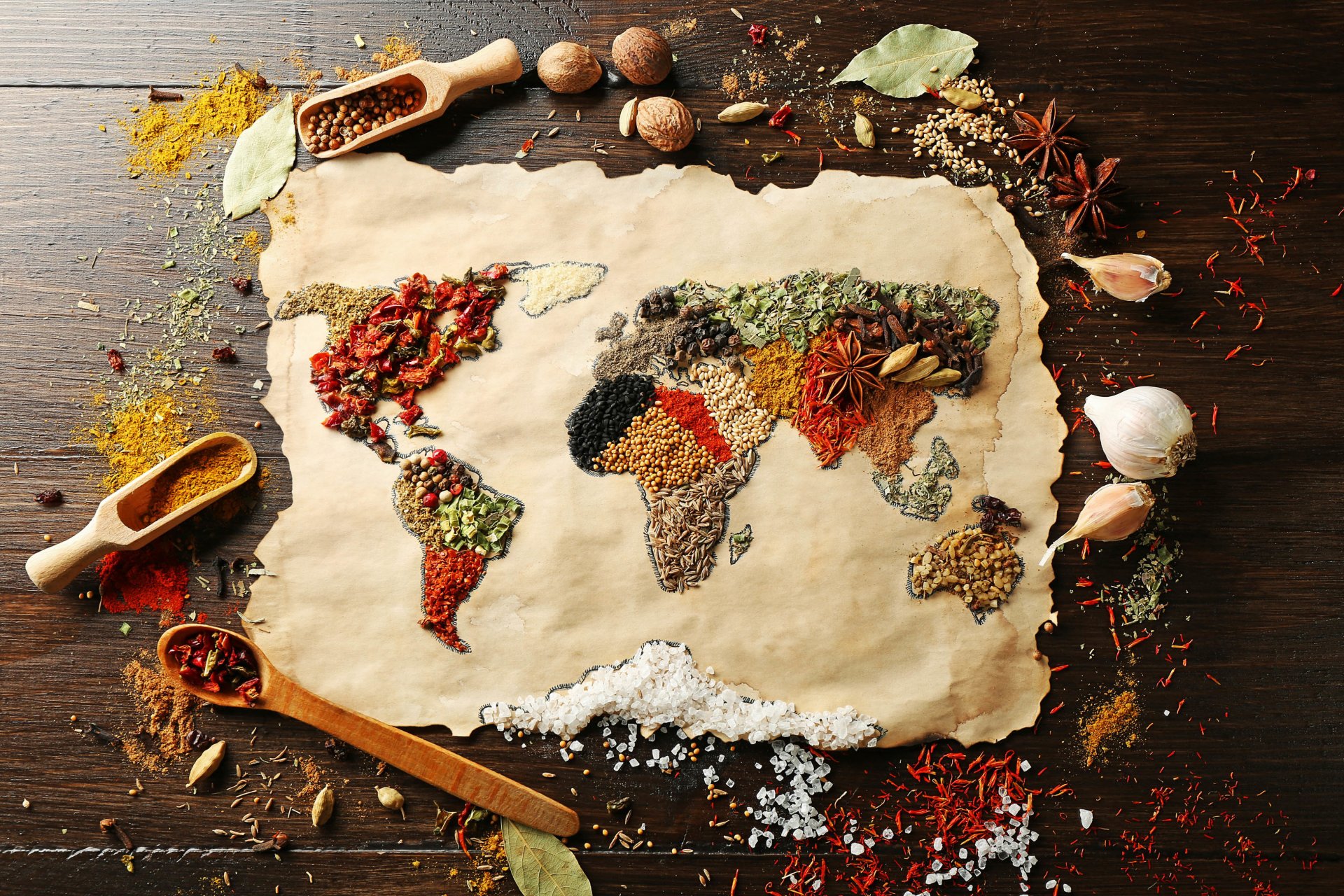 food spices spices surface world map continents continents seasonings nutmeg red black pepper curry cloves coarse salt bay leaf anise garlic saffron thyme good idea creative positive table yum-yum blurriness bokeh wallpaper