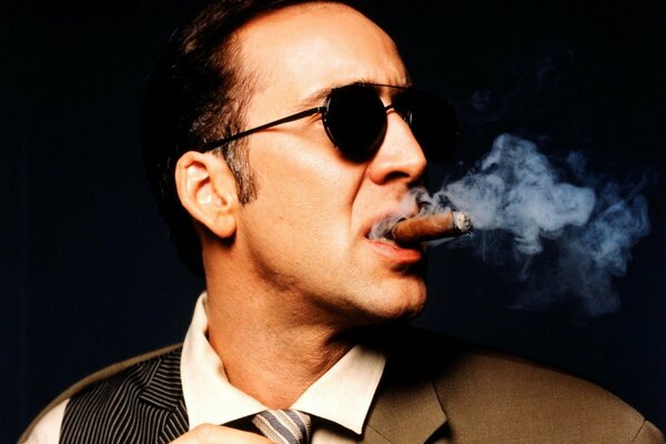 Nicolas Cage with a cigar in his mouth