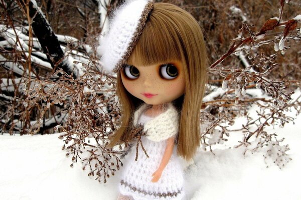 Cute doll in a snow outfit