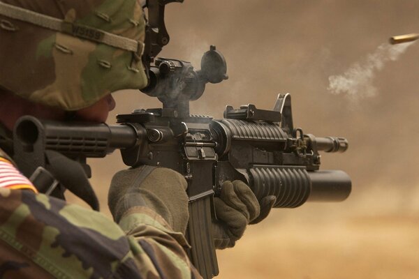 A military man with a gun in his hands