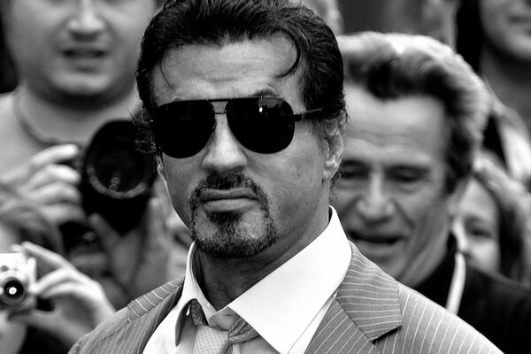 Sylvester Stallone mit dunkler Brille