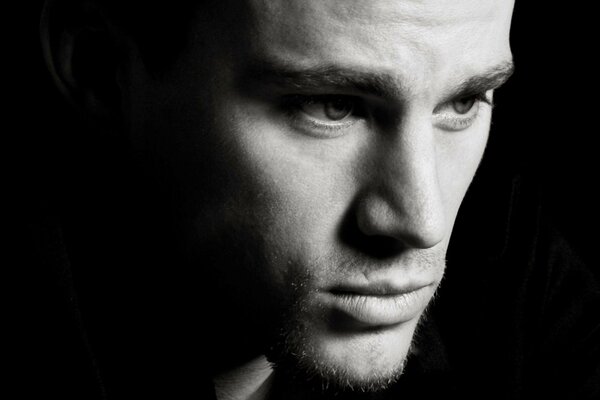 Portrait of channing Tatum s face on a black background