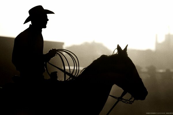 Painting silhouette of a cowboy on a horse