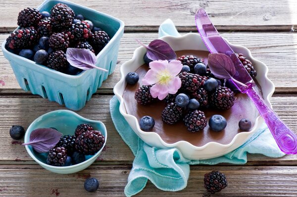 Still life with pie, berries, flower and leaves