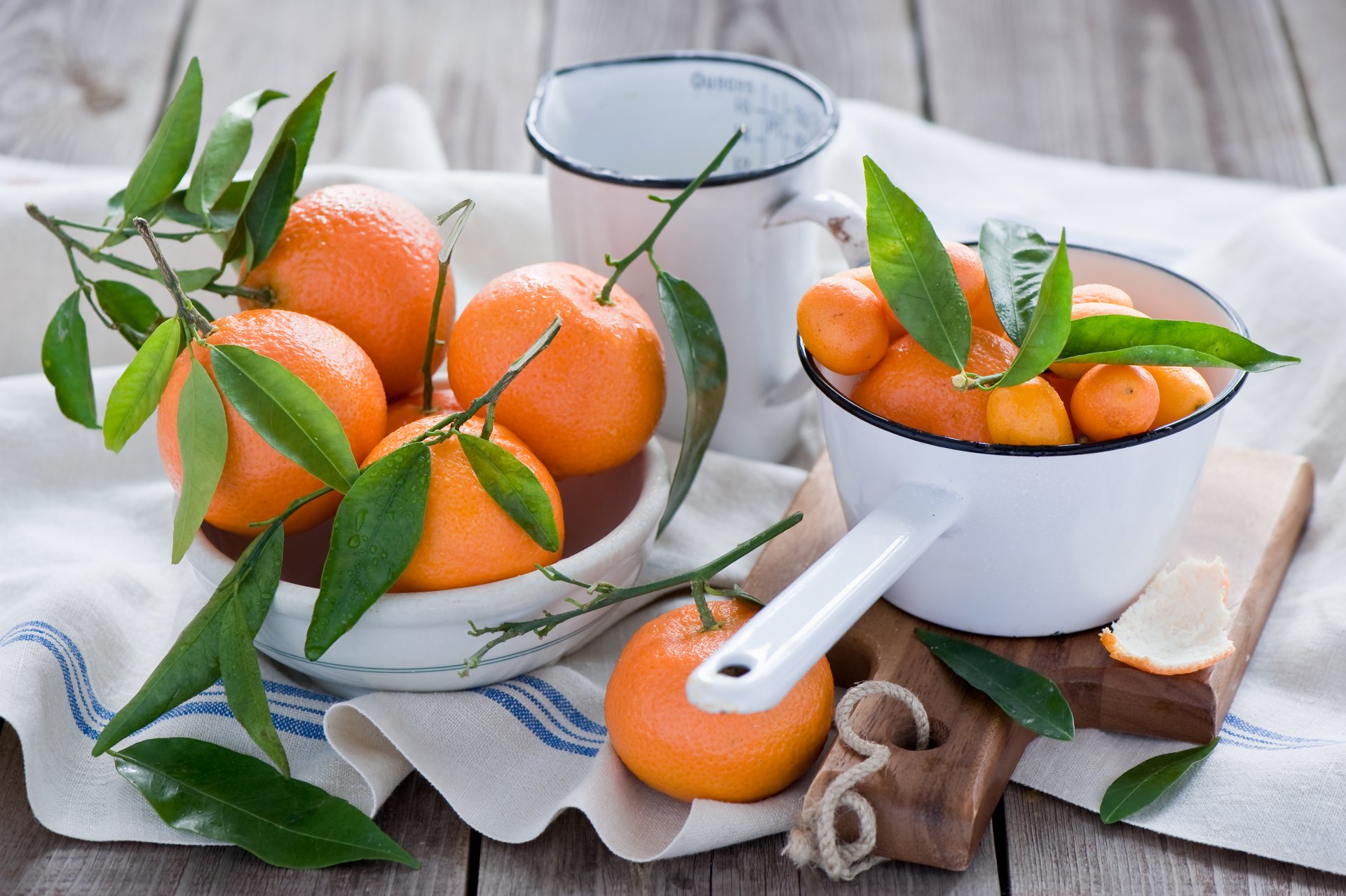 mandarins kumquats fruits orange citrus leaves drops tableware board napkin anna verdina