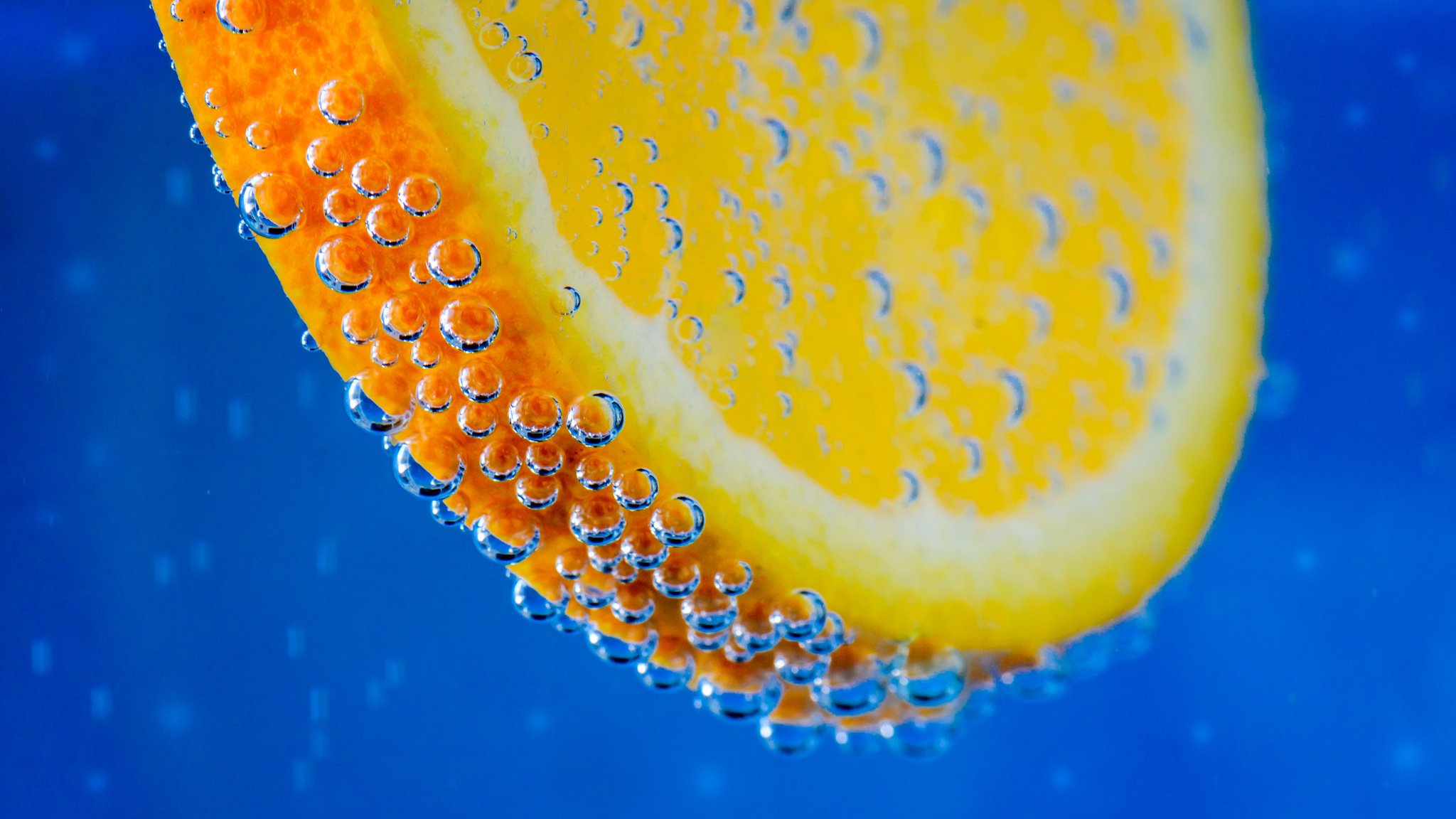 orange fruit in water bubbles bubble