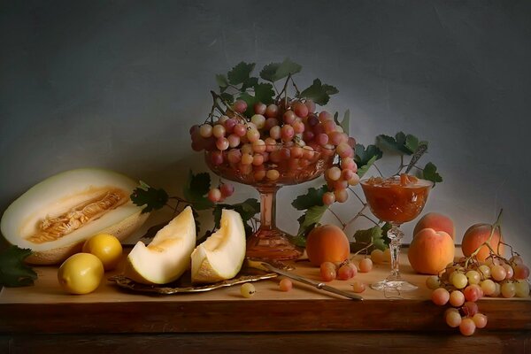 Autumn still life with lemon and grapes