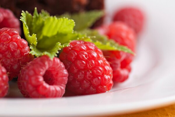 Fresh raspberries with a leaf