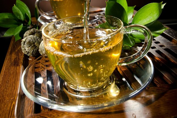 Tea with leaves in a glass cup