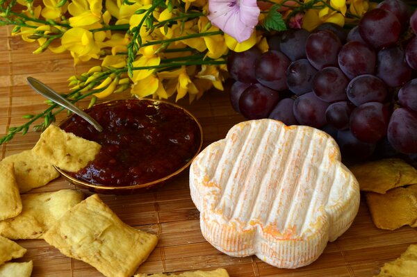 Photos of food. Cheese, chips and jam with grapes