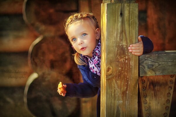 A child in the village. Girl with pigtail