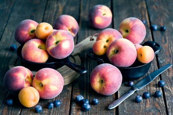 Peaches and apricots on the table. Still-life