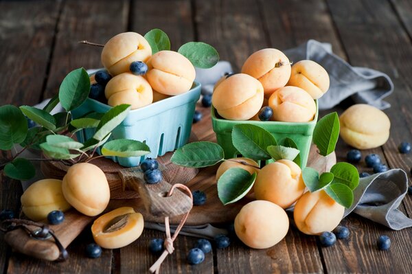 Apricots and blueberries on the table