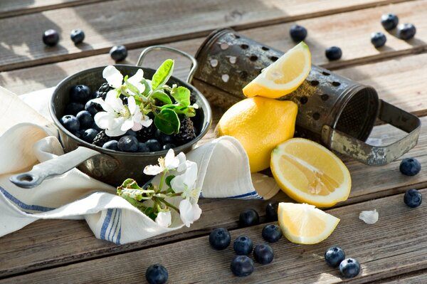 Still life blueberries and lemon on the table