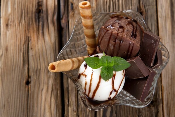 Ice cream with chocolate and waffle tubes