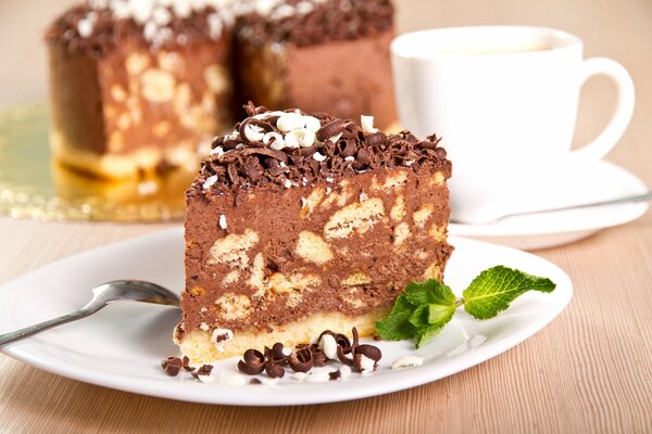 A piece of chocolate cake on a saucer for tea