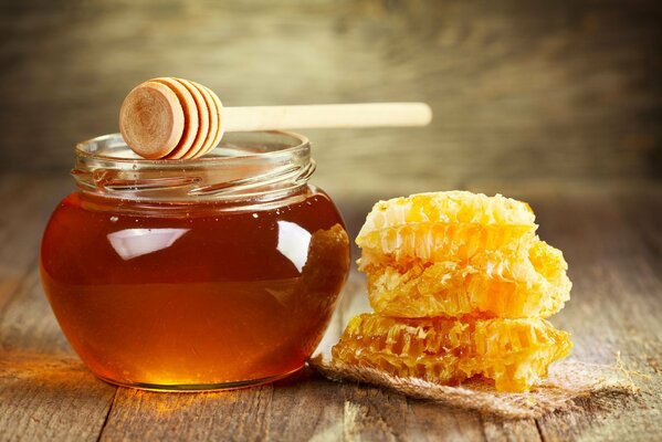 Honey in a jar is on the table