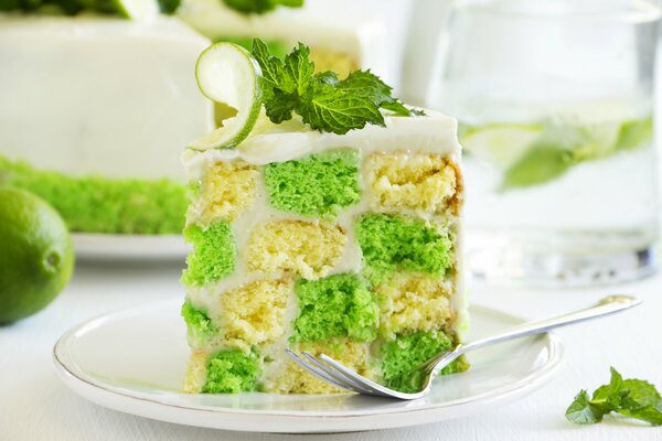 A slice of cake with lime and mint