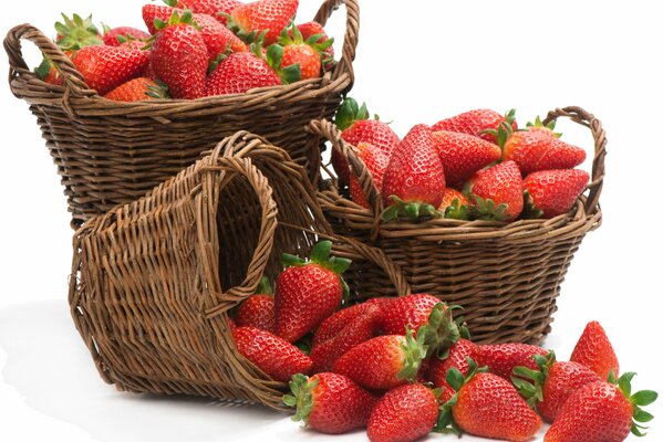 Fresh strawberries in wicker baskets