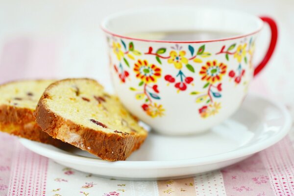 Lemon cupcake with a cup of tea