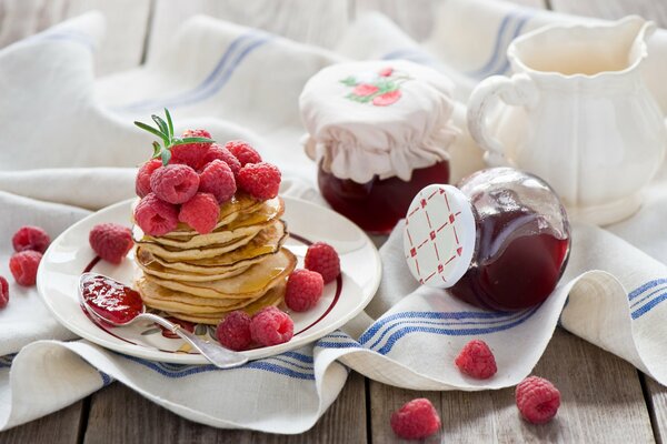 Pancakes with jam for breakfast. Delicious snack