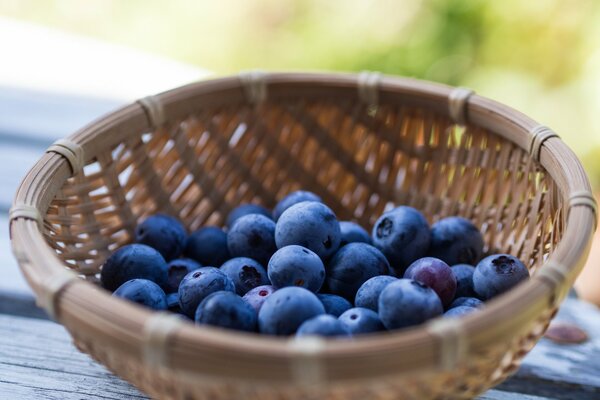 Fresh blueberries in a basket on the table