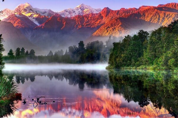 Mist of alpine meadows over the lake