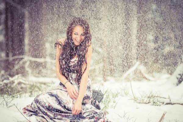 Beautiful girl in the snow in winter