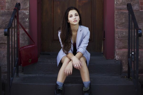 Photo shoot of Emily Rad on the steps at the door