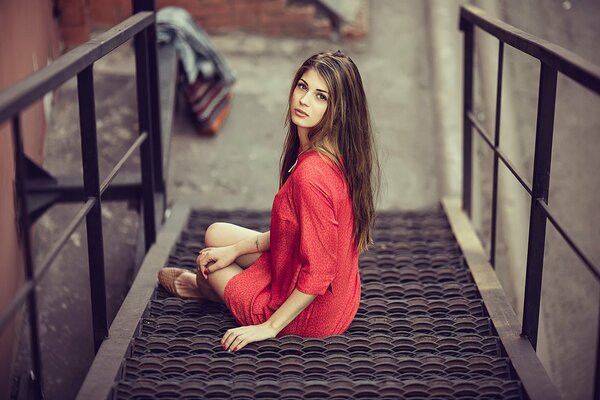 Long-haired girl in a red dress