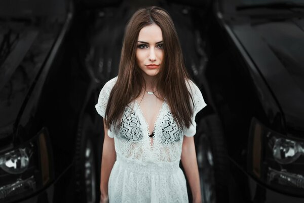 Portrait of Lera on the background of a city car