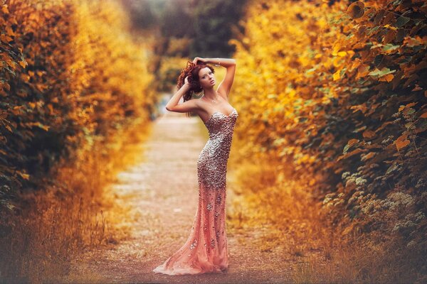 The idea of an autumn photo shoot in a long dress