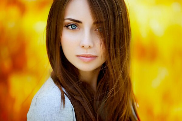 Portrait of a girl. Brown-haired woman s look