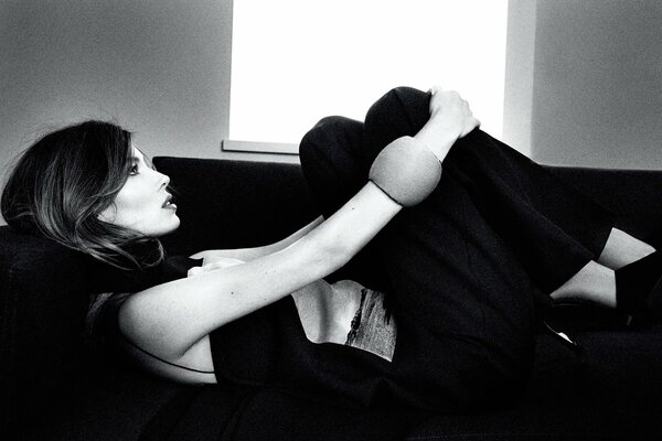 Jessica Biel lies on the couch at a photo shoot