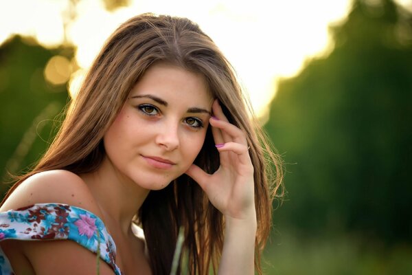 Brown-eyed girl against the background of nature